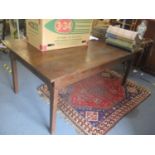 An American Texas Weavers pine table with a planked top on square legs, 30 1/4" H x 72" W