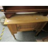 An Edwardian light oak wash stand with extended back, single cupboard door with Art Nouveau handle