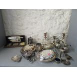 A selection of silver and silver plate to include a continental silver slave bangle mounted on a