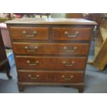 A reproduction walnut low chest of two short and three long drawers 31" H x 29 1/2" W