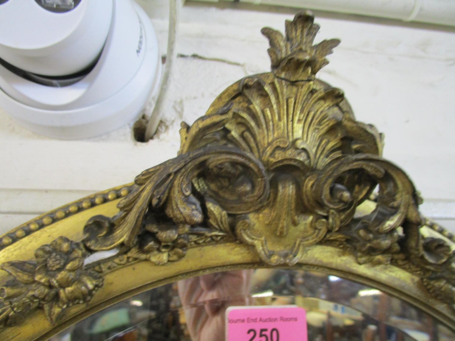 A late Victorian oval gilt framed wall mirror with scrolled leaf and styalized acanthus leaf - Image 3 of 6