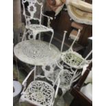 A white painted metal circular garden table and set of chairs 27 1/2" H x 38" W