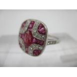 A platinum Art Deco style ring set with rubies and diamonds, fashioned as a cross size M/N, 4.2g