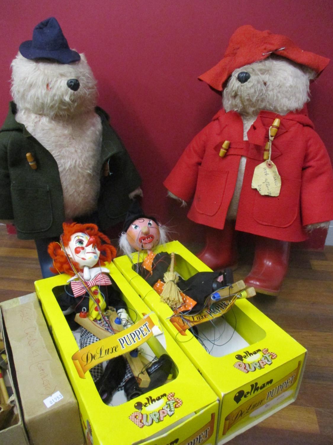 Two Paddington bears, two Pelham puppets to include the witch and the clown and a table top