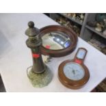 A Cornish stone and marble lamp in the form of a lighthouse, together with a circular mahogany