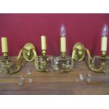 A pair of early 20th century gold painted metal wall lights A/F, with glass droplets and rams head