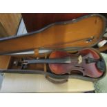 An early 20th century cased violin and bow, total length 23" long
