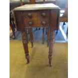 A Victorian walnut work table with two small drawers