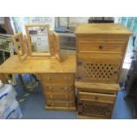 A pine four drawer desk, together with a trifold dressing table mirror and two bedside cabinets