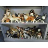 A mixed lot of ceramic dog ornaments to include Melbaware, Coopercraft, Beswick and many others