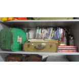Military, motoring and other books along with car manuals, Castrol can and another, a small case and