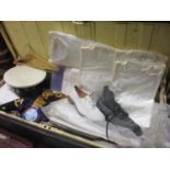 A vintage trunk containing a collection of mid 20th century Royal Navy uniform and accessories