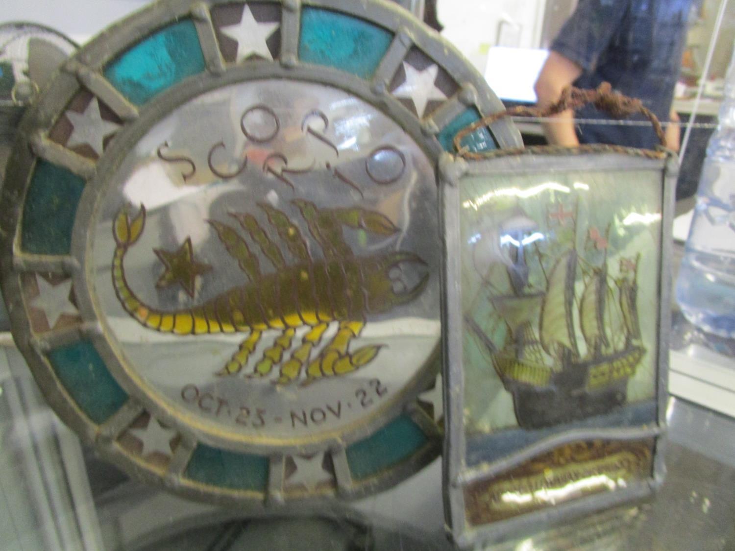 An early 20th century stained glass roundel depicting a mill house by a river, and two other later - Image 5 of 6