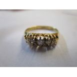 An 18ct gold ring set with five diamonds, 4.5g