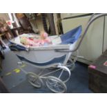 Royale child's toy pram with white and blue painted carriage circa 1960's, containing various