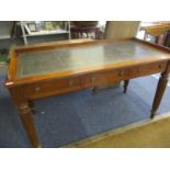 A Victorian mahogany writing table with a scriber, over three drawers, on turned reeded legs 30 x 56