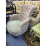 A small light brown velour bedroom chair with mahogany turned front legs