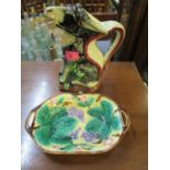 A continental majolica jug in the form of a seated donkey, stamped BA to base and majolica desk with