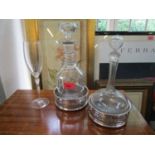 Glassware comprising a Victorian decanter and a Champagne flute and a pair of silver plated bottle
