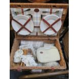 An Optima wicker picnic basket, fully fitted with contents