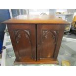 An early 20th century oak smokers cabinet made from partly burnt oak, taken from Selby Abbey after