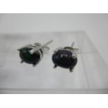 A pair of black Ethiopian opal stud earrings in silver settings Location: CAB
