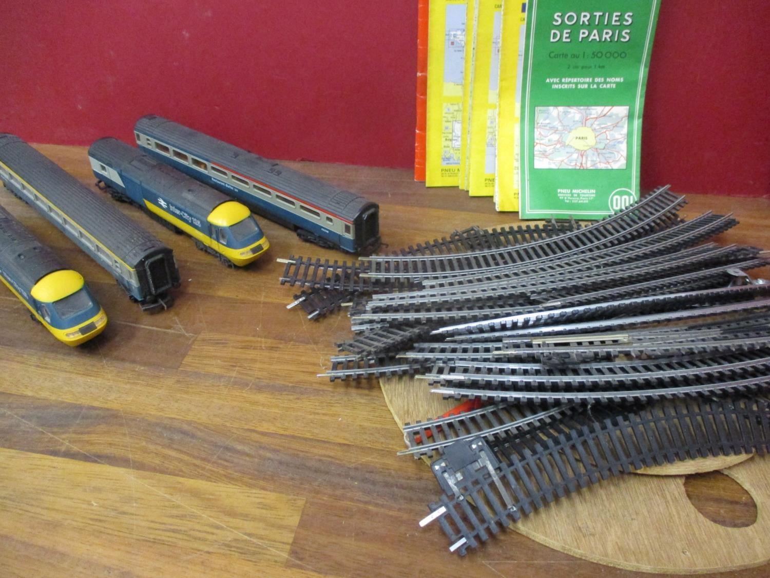 Two toy Intercity 125 engines and two carriages, together with track, a turnstile and vintage