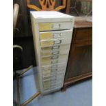 A vintage painted metal filing cabinet, 38 1/2" x 11" x 16"