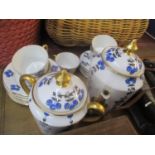 A Limoges Bernaudaud & Co porcelain part tea service having a white ground with blue and yellow