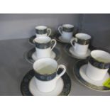 A set of six Royal Doulton Carlyle pattern coffee cups and saucers