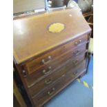 An early 20th century inlaid mahogany bureau with small box within