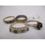 Four 9ct gold rings to include a garnet cluster ring and others A/F