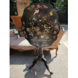 A Victoria paper mache tilt top pedestal table with painted and inlaid mother of pearl floral