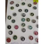 A collection of 1947 Artid buttons to include Ice skater, Scorpion and Temple in various colours