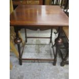 An early 20th century oak occasional table on turned block legs and an oak drop leaf table