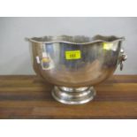 A large silver plated fruit bowl with ring handles on lions heads