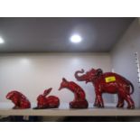 A Royal Doulton flambe model of an elephant pre 1994, together with a flambe fox, rabbit and bulldog