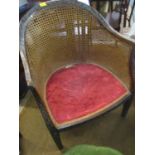 A late Georgian mahogany blind fretwork and caned armchair