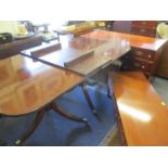 A 20th century mahogany extending table with one extra leaf
