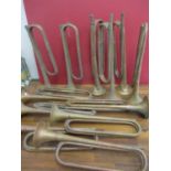 Twelve mixed military bugles to include B.B.I.M Ltd examples in copper and brass