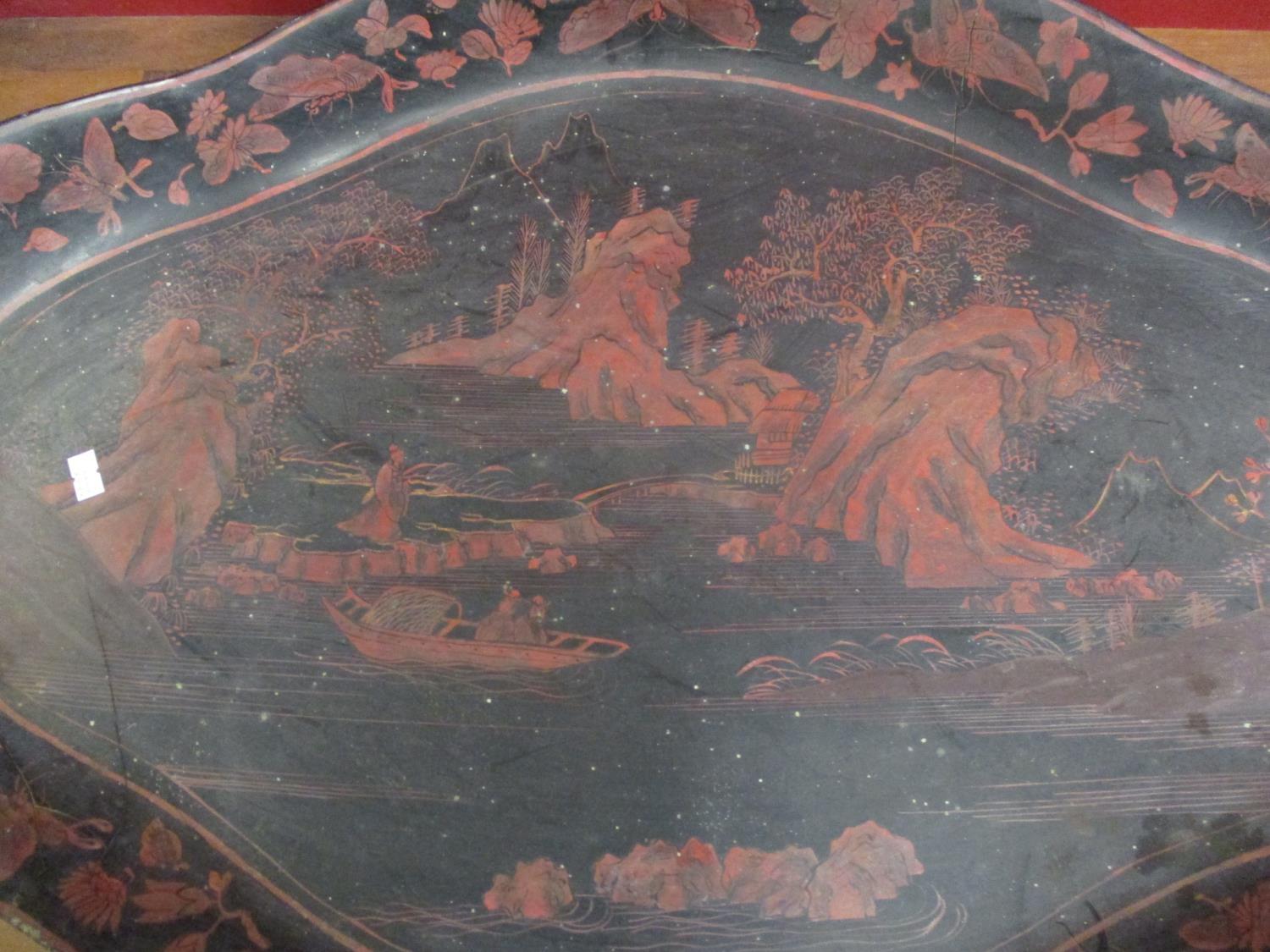 A large Oriental black papermache tray with red painted scenes - Image 2 of 2