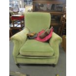 An Edwardian Harrods Howard style upholstered mahogany armchair on square tapering front legs and