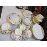 A Minton Golden Heritage part dinner service having a white ground with gold coloured rim,