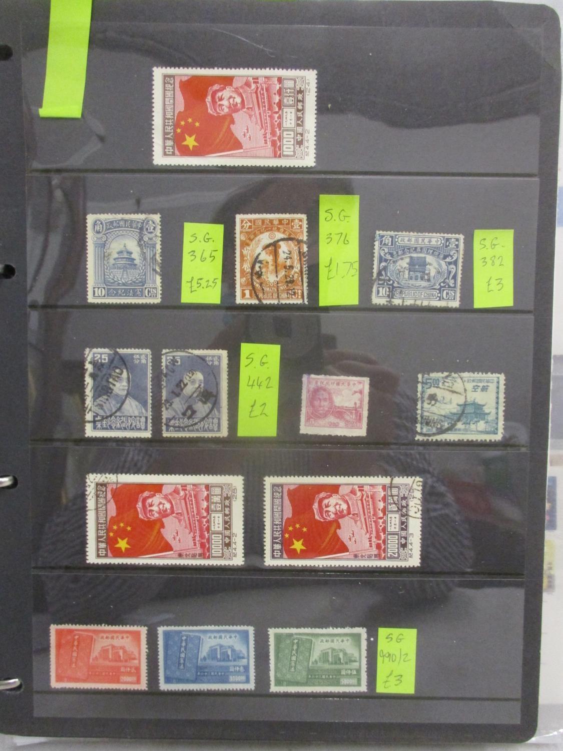 Postage stamps and postcards of China, used and unused mounted on pages and stock cards