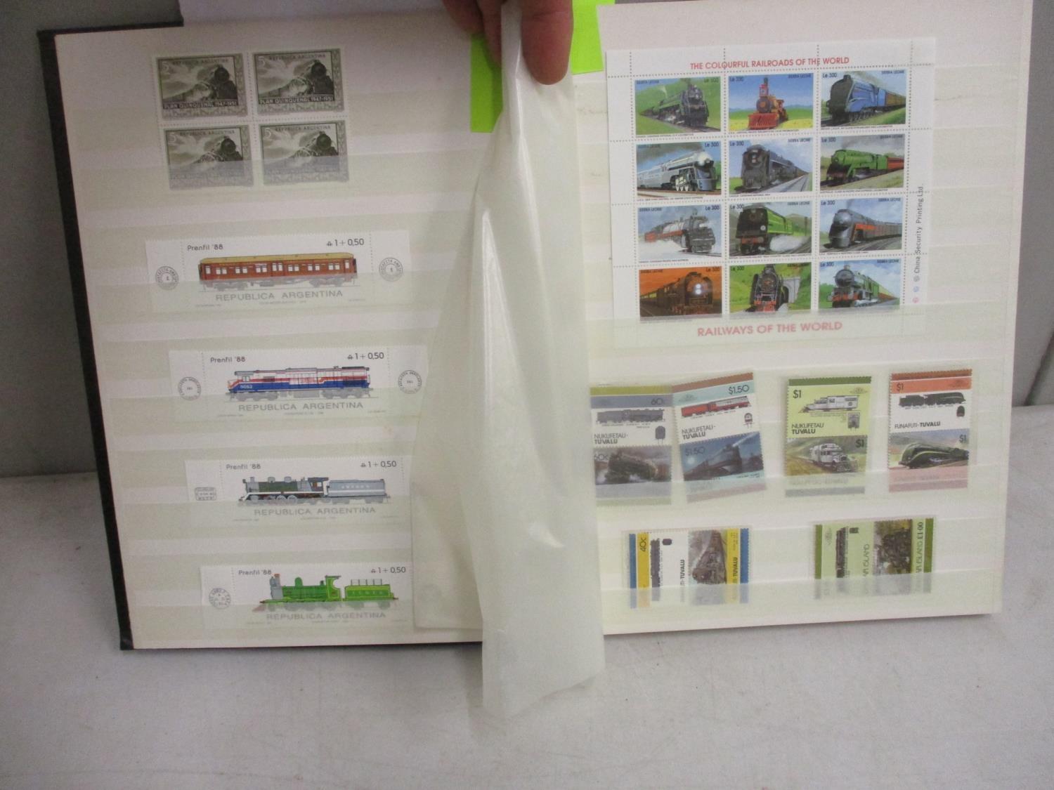 A stamp album containing thematic train related examples