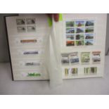 A stamp album containing thematic train related examples