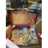 A mahogany box containing vintage costume jewellery and ladies watches to include gold plated items,