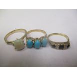 Three 9ct gold rings to include a turquoise ring, opal ring and a sapphire and diamond ring, 6.9