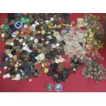 A collection of early 20th century fabric covered buttons, military and blazer buttons, vintage