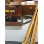 A Theodolite and tripod and a stereoscope in a case